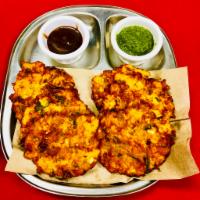 Vegetable Pakora (vegan) · Mixed vegetables seasoned with spices and mixed in a homemade batter and deep fried.