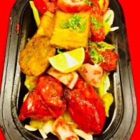 Lamb Shish Kebab · Minced lamb seasoned with onion, herb, spices and grilled on tandoori oven.