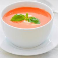 Tomato Soup · Fresh tomato soup made with green peas and spices.