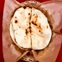 Naan (Recommended) · Traditional Indian style tandoori bread in tear drop shape.