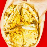 Aloo Paratha · Whole wheat bread stuffed with potato, green peas and spices.