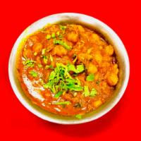 Chana Masala (Vegan) · Garbanzo beans cooked with ginger, garlic, tomato and spices.
(Naan bread recommended)