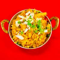 Chicken Biryani · Basmati rice cooked with chicken breast, vegetables, nuts, raisins and spices.