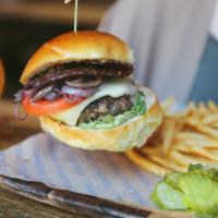 Chef's Burger · 8oz Pat La Frieda burger, herbed grilled red onion,  candied bacon, fontina cheese, lettuce,...