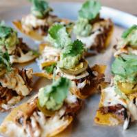 Smoked Pork Nacho  · Smoked in-house, pepper jack, ancho chili salsa and guacamole.