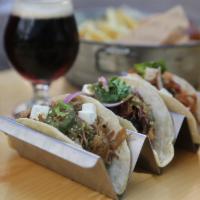 Brisket Tacos · House-smoked and hand pulled brisket in adobo, pickled red onion, cilantro, cotija cheese