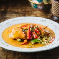 Panang Tilapia · Deep fried tilapia fillets topped with panang curry and bell peppers. Served with steamed ri...