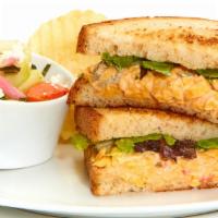 Spicy Pimento Cheese Sandwich · With mixed lettuce on toasted bread. Served with Chips and your choice of a Homemade Side.

