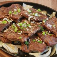 Beef Short Ribs (Gal Bi) · Korean style grilled short ribs. One of the most popular dishes in Korean barbecue. They are...
