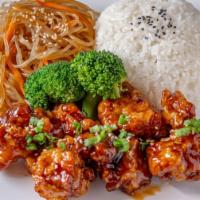 Korean fried Chicken Rice Bowl · Served with rice clear noodles and Broccoli.