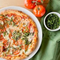 Margherita Pizza · Marinara sauce, mozzarella, tomatoes, fresh basil and roasted garlic.