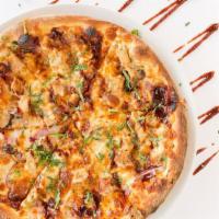 BBQ Style Chicken Pizza · BBQ sauce, mozzarella cheese, roasted chicken, red onions, cilantro and BBQ sauce.