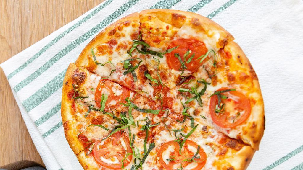 Classic Neapolitan Pizza · Extra virgin olive oil, mozzarella, fontina, fresh mozzarella, roasted garlic, fresh tomatoes and fresh basil.