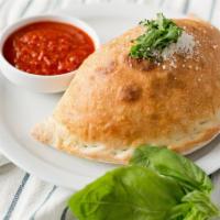 Build Your Own Calzone · Extra toppings are at an additional charge.