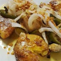 Bacalhau no Forno Special · A murro. Salt cod steak, oven roasted with peppers, onions, and potato. Topped with garlic o...