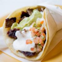 Super Taco · Whole pinto Beans, fresh salsa, cheese, sour cream, guacamole, and your choice of meat.