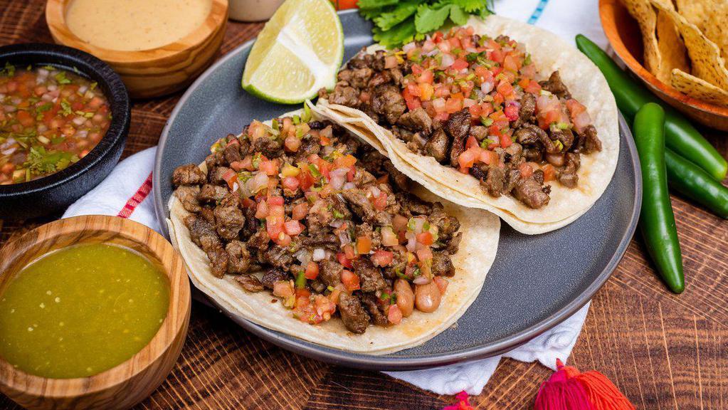 Regular Taco · Whole pinto Beans, fresh salsa, and your choice of meat.
