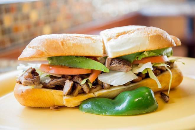 Torta · Fresh roll with mayo, beans, lettuce, tomato, avocado, sour cream, cheese, and your choice of meat.