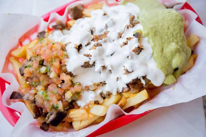 Super Nacho Fries · Black Beans, cheese, guacamole, sour cream, salsa, and your choice of meat.