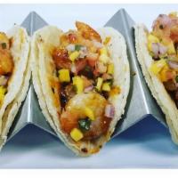 Chipotle Shrimp Tacos · 3 tacos on corn or flour tortilla with chipotle shrimp, mango pico de gallo and cilantro vin...