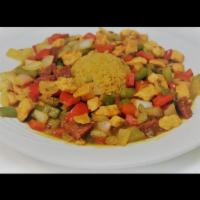 Spicy Chicken  · Chicken breast cubes cooked with Caribbean sausage, green, red pepper, onions, sofrito and r...