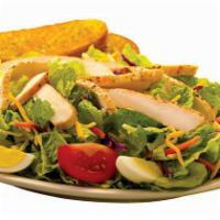 Grilled Chicken Salad · Grilled chicken, Monterey jack and cheddar cheese, smokehouse bacon, tomatoes, croutons and ...