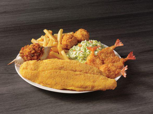 White Fish, Shrimp, & Crab Meal · Our southern-style white fish, four butterfly shrimp and a stuffed seafood crab shell served with your choice of two sides and hush puppies.