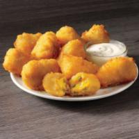 Jalapeño Poppers · Golden fried jalapeños and cheese that’s just begging to be dipped in ranch, will start your...