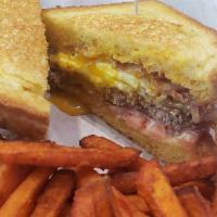 Morning Moo Burger · On grilled Texas toast, topped with a fried egg, American cheese, bacon, Moo sauce and tomat...