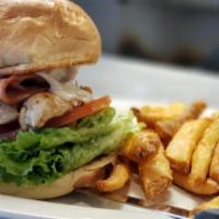Honey Chicken Sandwich · Chicken breast basted with honey Dijon and topped with ham and Swiss cheese, served on a kai...