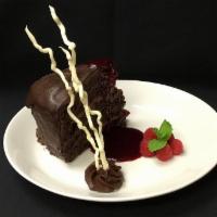 MOONLIGHT CHOCOLATE CAKE · Layers of Rich Chocolate Cake, Indulgent Mousse, Raspberry Preserves, Encased in a Chocolate...