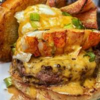 Surf and Turf Burger · 8oz patty ,Toasted bun , jalapenos spicy queso, bacon  4 oz skirt steak , main lobster tail