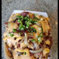 Made Tatertots · Caramelized onions , bacon Cheese Sauce Mob sauce
