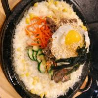 24.Mixed Vegetables Beef Bibimbap · Mixed vegetables with rice, beef and hot pepper paste in a stone bowl.韩式牛肉拌饭