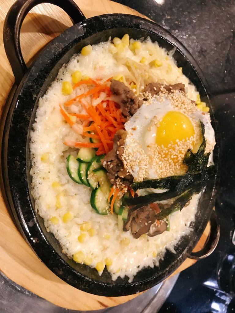 24.Mixed Vegetables Beef Bibimbap · Mixed vegetables with rice, beef and hot pepper paste in a stone bowl.韩式牛肉拌饭