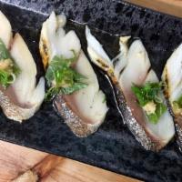 Saba Aburi · Seared mackerel with green onion, ginger & ponzu sauce.