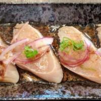 Albacore Tataki · Seared white tuna, green onion, dried onion & ponzu sauce.
