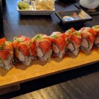 R.Y. Roll · Imitation Crab, avocado, cucumber topped with spicy tuna, sesame seed, green onion, tobiko e...