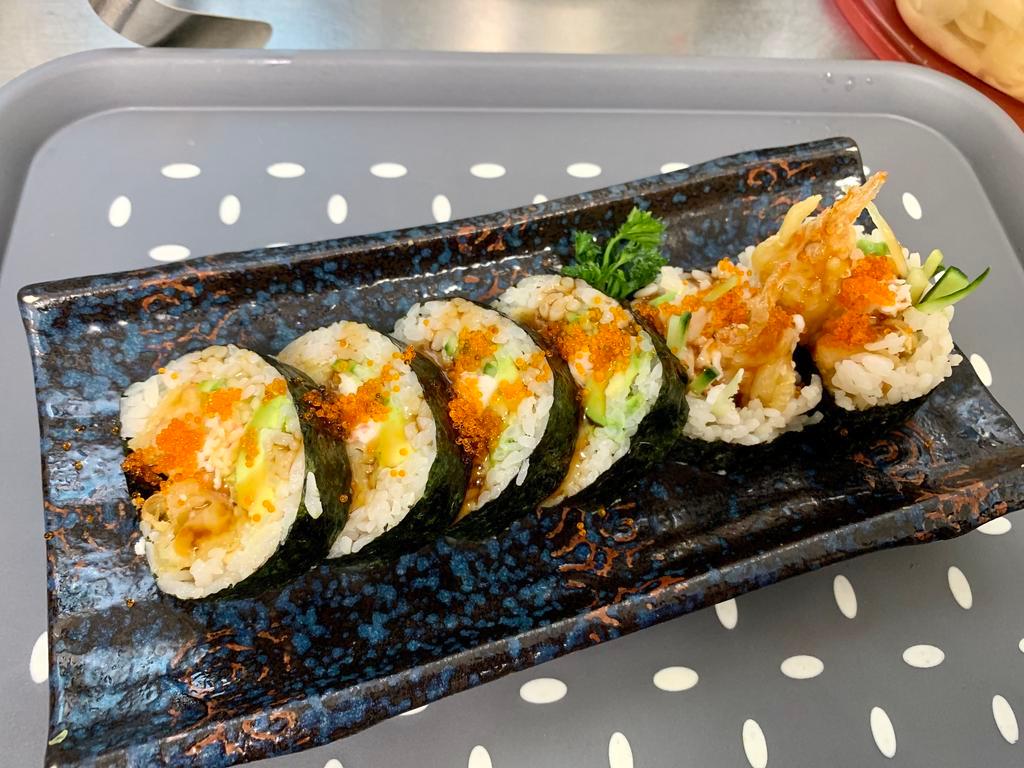 Shrimp Tempura Roll · Deep-fried shrimp, Imitation crab, avocado, cucumber, tobiko, and unagi sauce