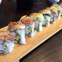 Dragon Roll · Imitation Crab, avocado topped with eel, eel sauce, and sesame seed