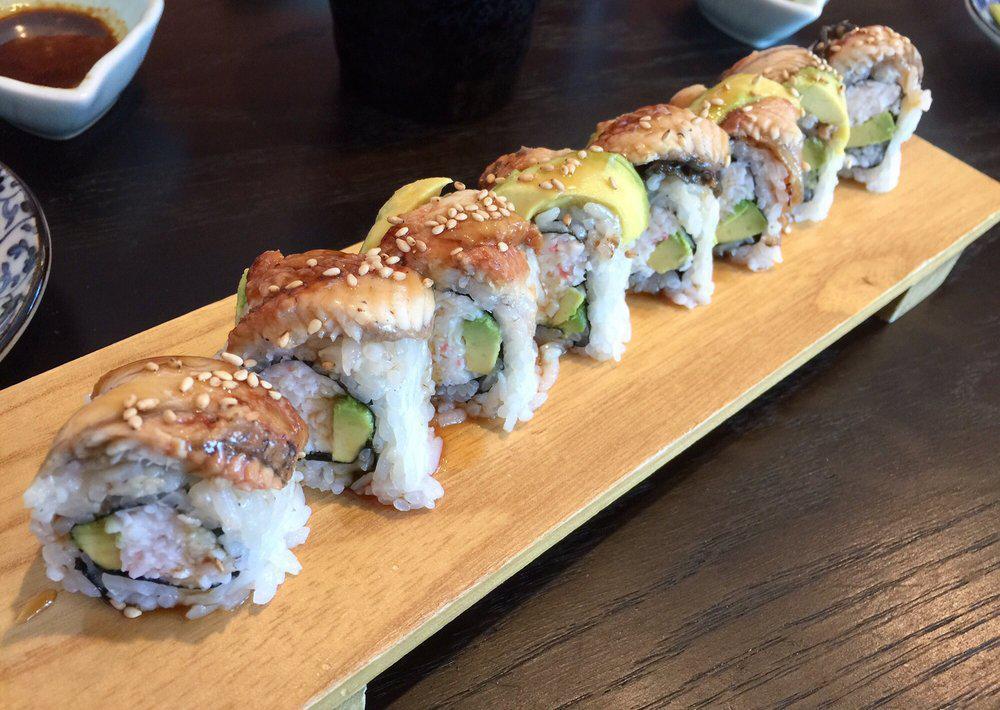 Dragon Roll · Imitation Crab, avocado topped with eel, eel sauce, and sesame seed