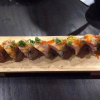 M.I. Roll · Spicy albacore topped with seared tuna, spicy mayo sauce, eel sauce, sesame seed, green onio...