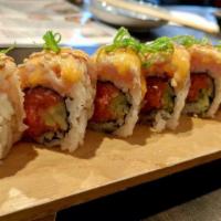 Ultimate Roll · Spicy tuna and cucumber topped with seared albacore, spicy mayo sauce, eel sauce, sesame see...