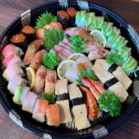 Combination Party Tray · Hamachi sashimi (4 pcs), shrimp sashimi (4 pcs), sake sashimi (4 pcs), scallop sashimi (4 pc...