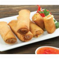 Fried Spring Rolls · Crispy spring rolls filled with vegetables and deep-fried to golden perfection served with p...