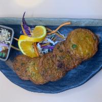 Thai Fish Cake · Tod mun pla. Thai Red-curry-flavoured fish cakes (cod fish) mix with herbal sliced and deep ...