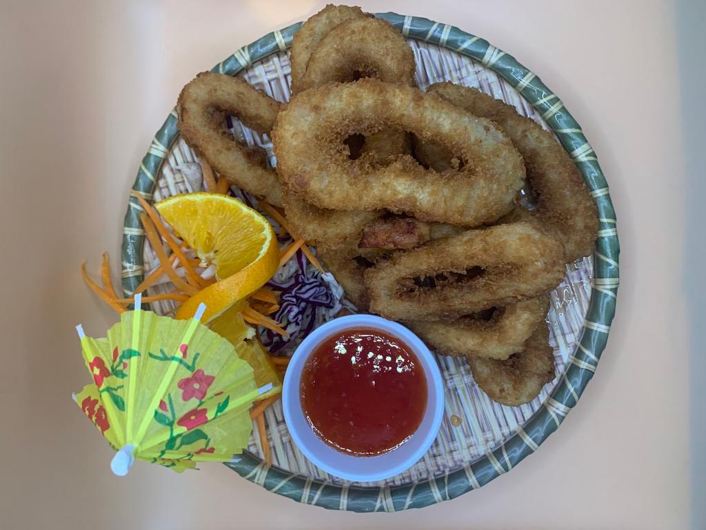 Fried Calamari ปลาหมึกทอด · Lightly battered calamari, breaded, golden-fried served with sweet & sour sauce
