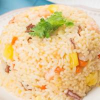 Pineapple Fried Rice · Fried rice with pineapple, egg, carrots, peas, onion, scallion, and cashew nuts.