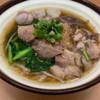 Stew pork Noodle soup ก๋วยเตี๋ยวหมูตุ๋น · slow cooked pork , bean sprout , Chinese broccoli , cilantro , Garlic , pork ball in thai st...