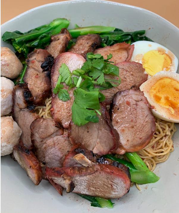 Dry Egg Noodle BBQ Pork บะหมี่แห้งหมูแดง · Red BBQ pork with egg noodle, boiled egg ,pork ball ,Chineses broccoli on top with red sweet sauce and peanut.
